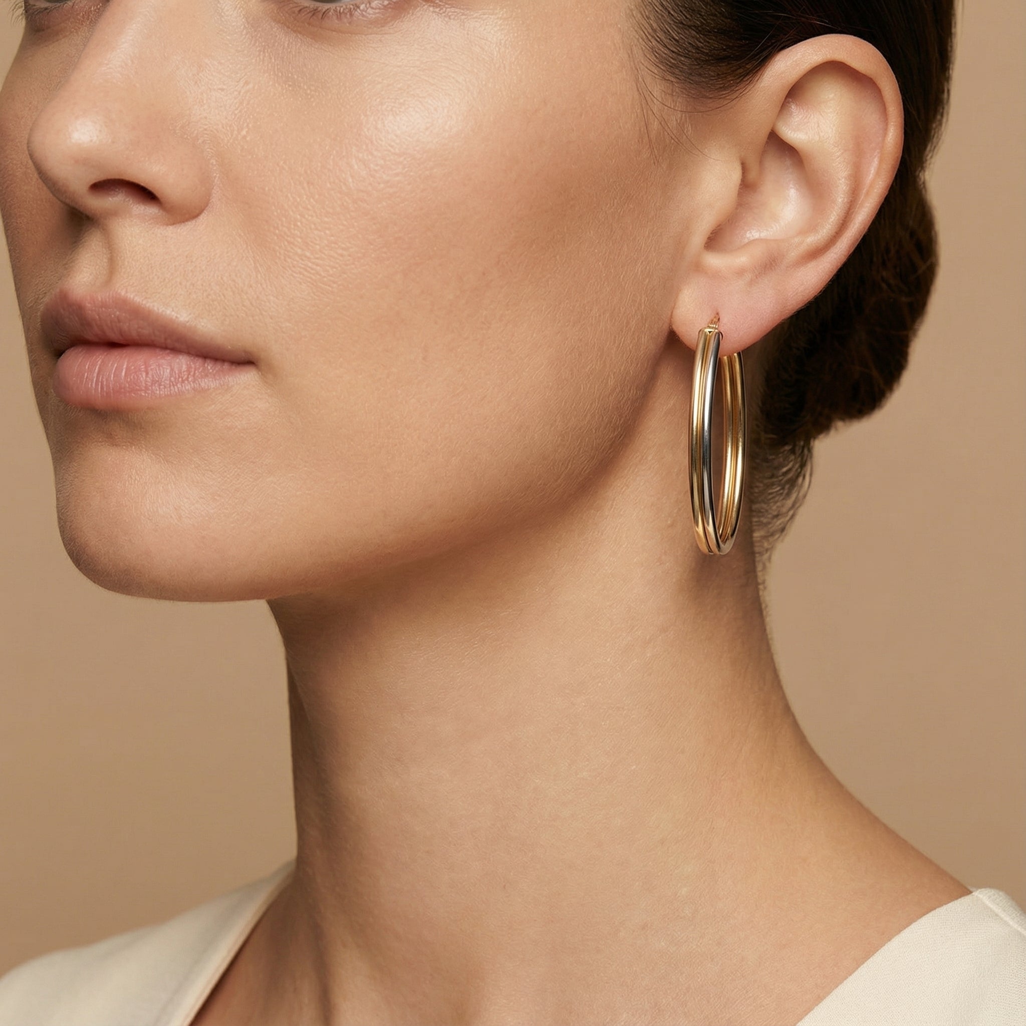 10K Yellow Gold Concordia Oval Hoop Earrings worn - lifestyle image