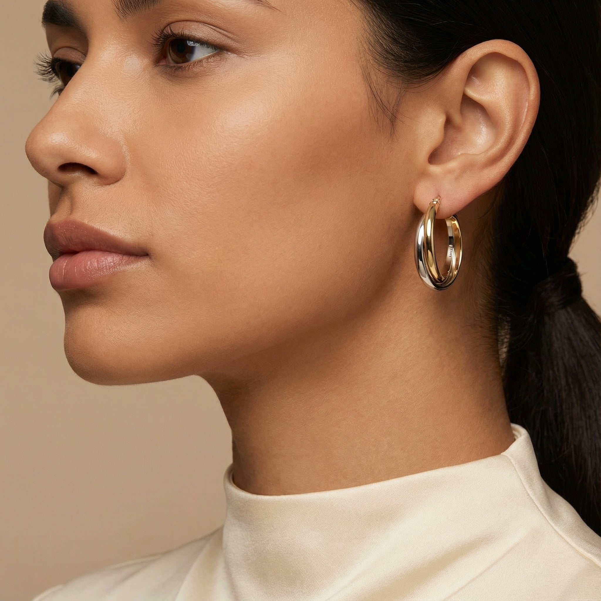 10K Yellow Gold Trinity Swirl Hoop Earrings worn - lifestyle image
