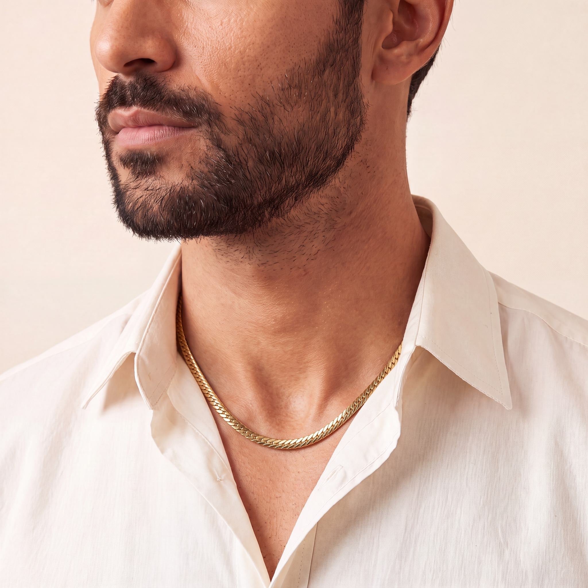 Man wearing a 10K yellow gold Veritas Enduring curb chain necklace, 4.6mm