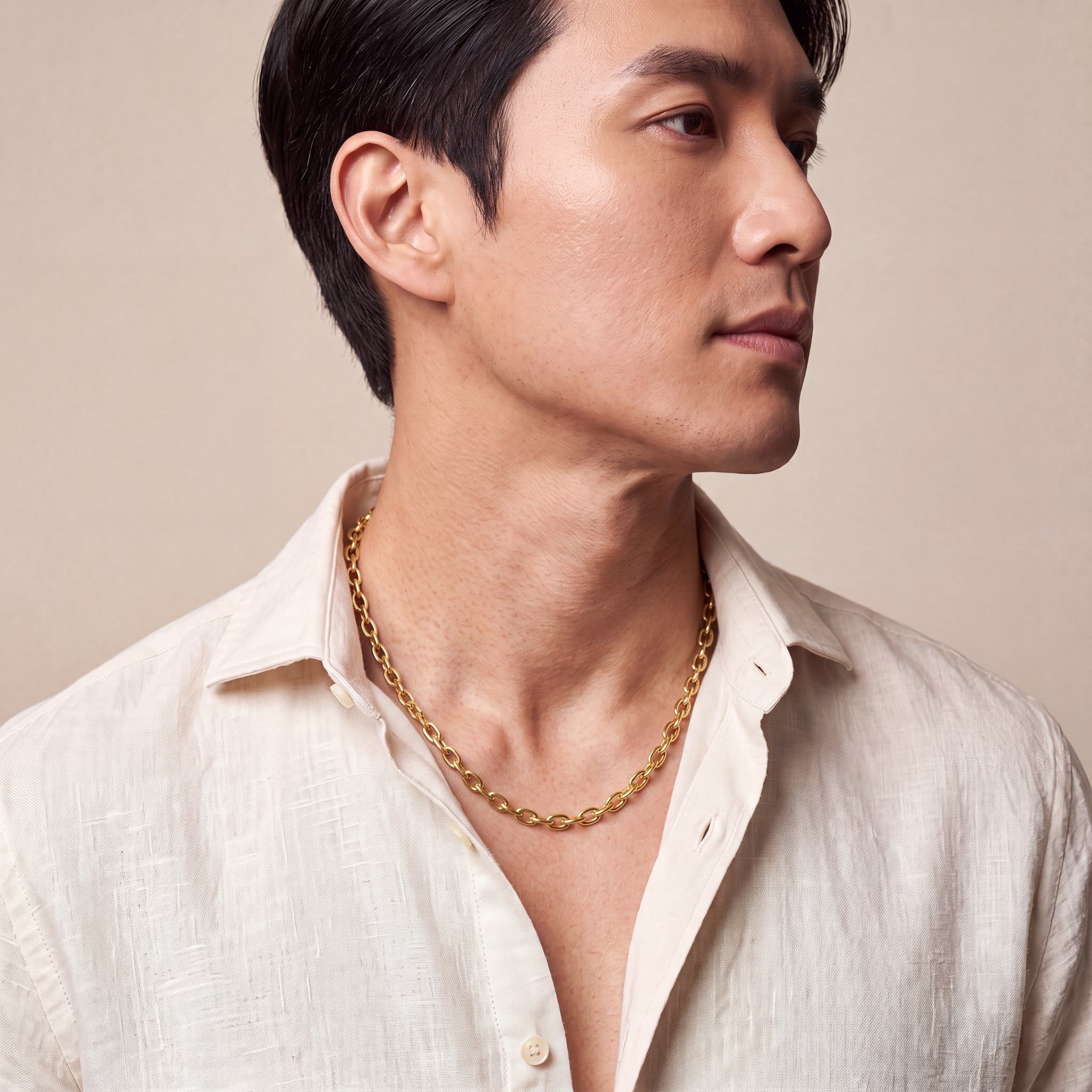 Man wearing a 10K yellow gold Vero Substantial oval cable chain necklace, 5mm