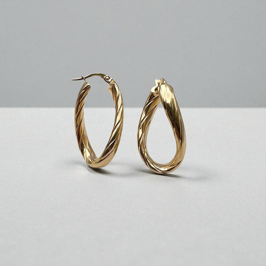 10K Yellow Gold Aqueous Twist Hoop Earrings - wavy ribbed oval design