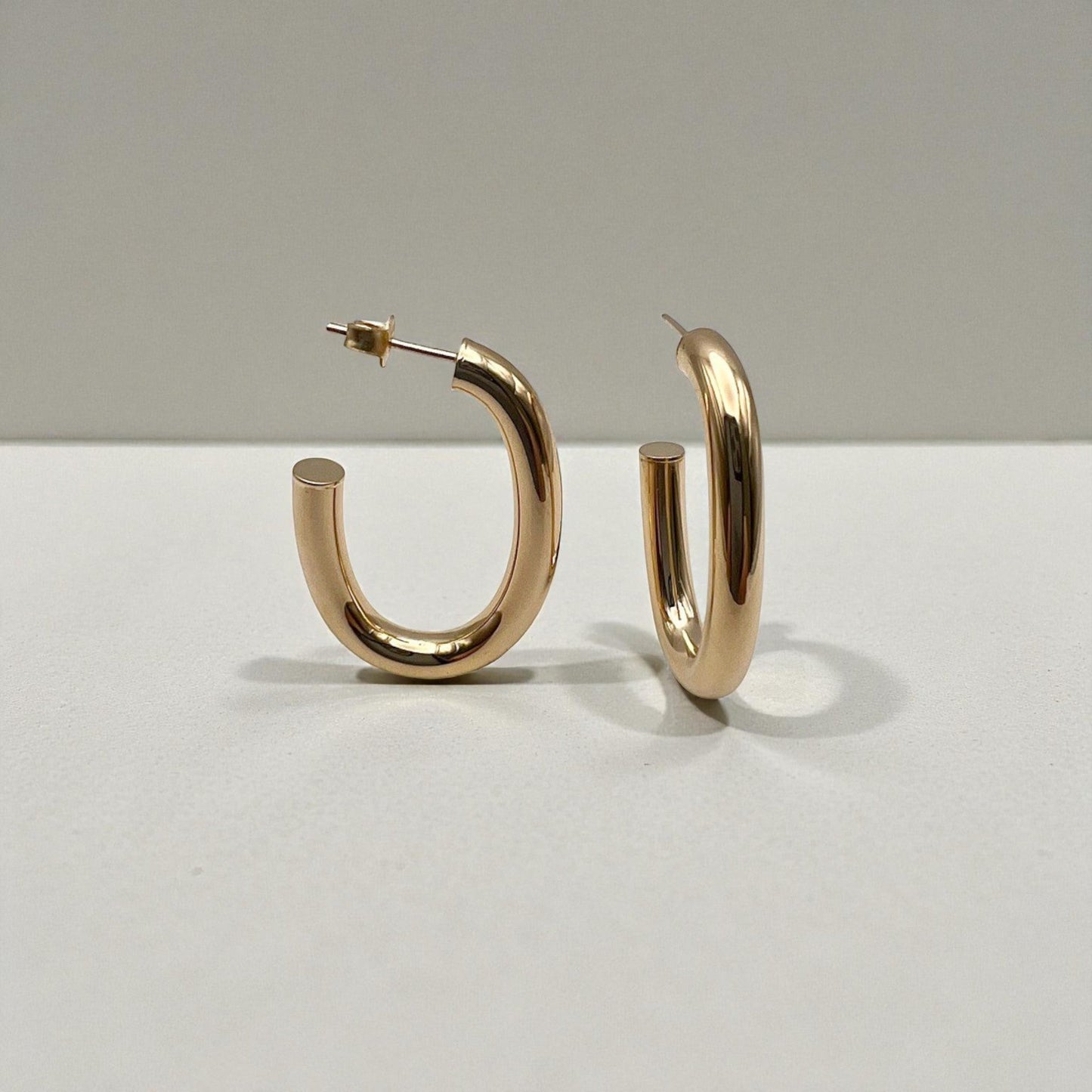 10K Yellow Gold Auric Crescent Hoop Earrings - U-shaped polished design