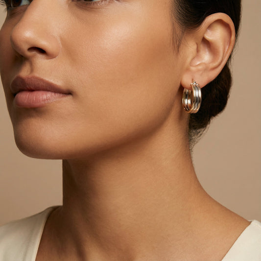 10K Yellow Gold Triad Embrace Hoop Earrings worn - lifestyle image