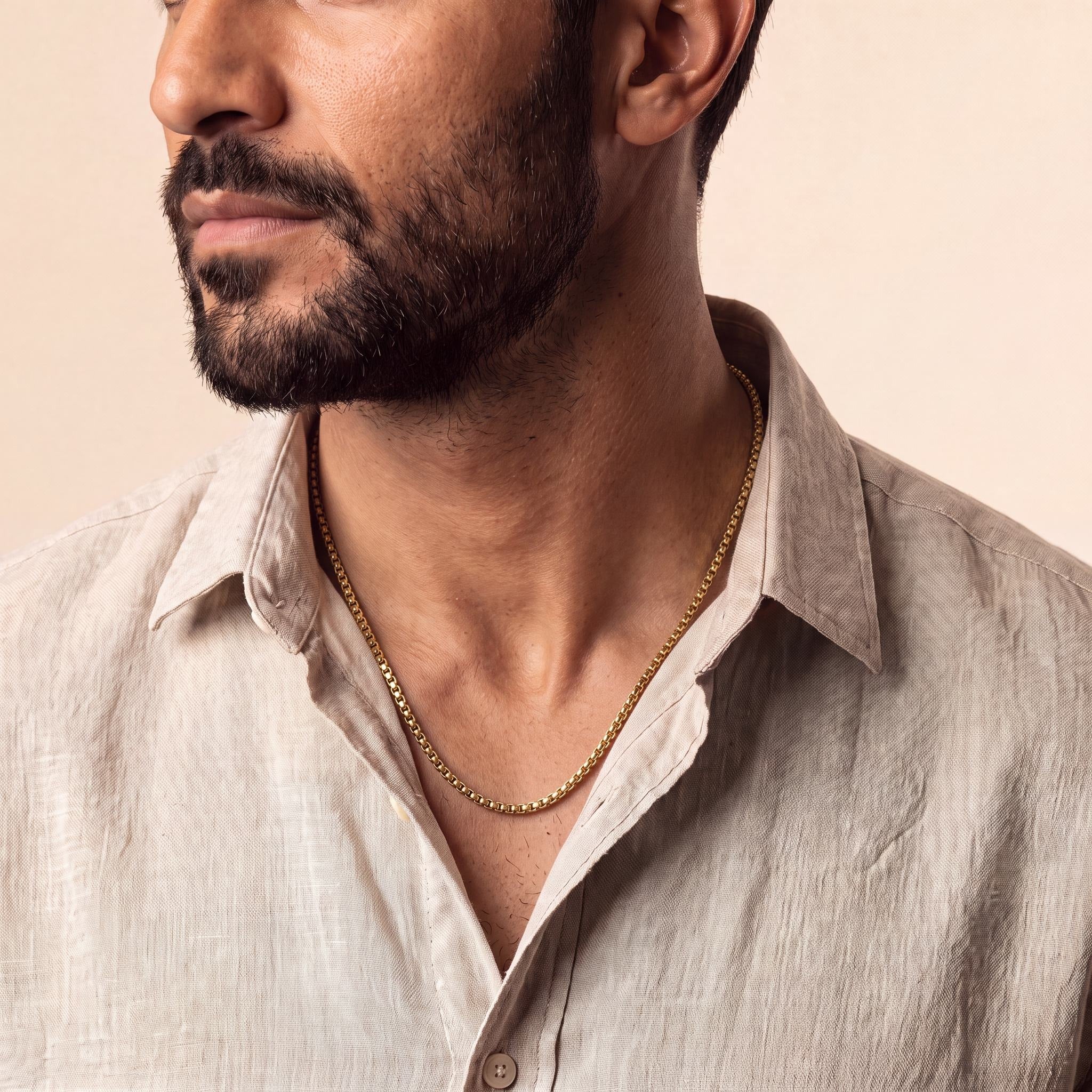Man wearing a 10K yellow gold Verve Substantial box chain necklace, 4.5mm