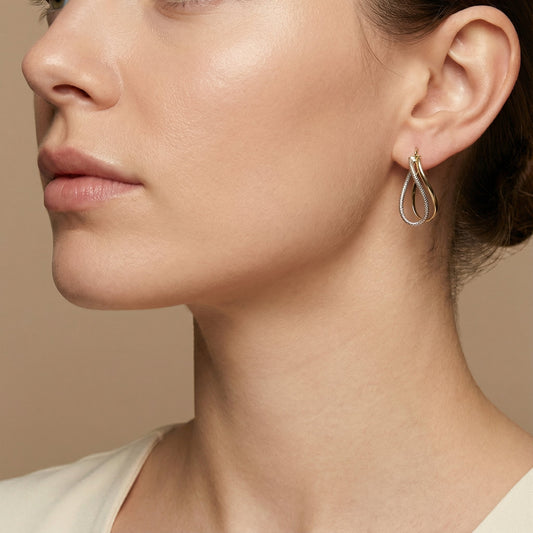 10K Yellow Gold Zephyr Twist Hoop Earrings worn - lifestyle image